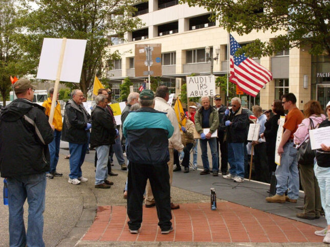 Group of people protesting in front of IRS building in 2013