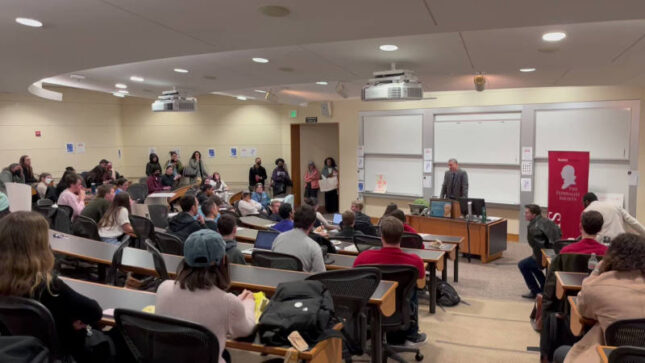 Kyle Duncan standing in lecture hall at Stanford Law during student protest